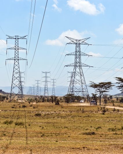 Rinnovabili • Electricity transmission towers and power lines across the landscape