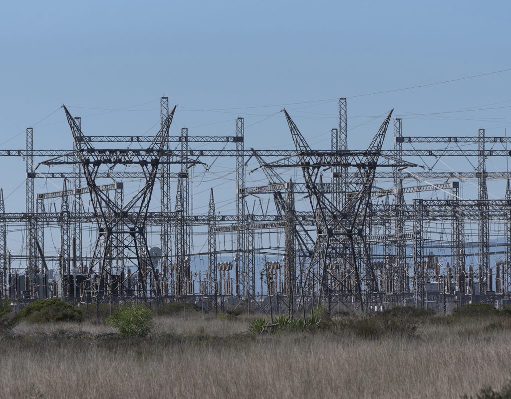 Electricity transmission pylons and power lines.